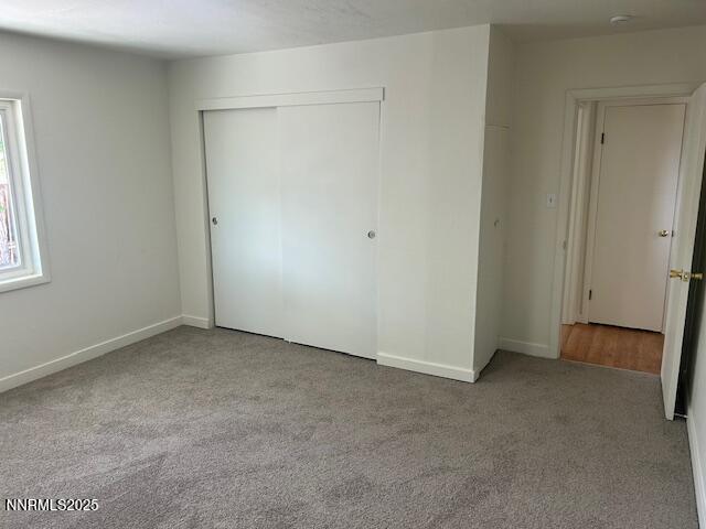3220 Rice Rd, Fallon, NV 89406 - unfurnished bedroom featuring carpet floors and a closet