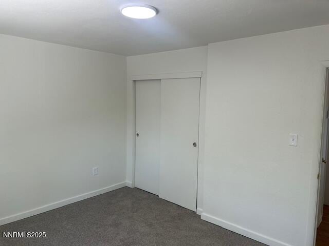 3220 Rice Rd, Fallon, NV 89406 - unfurnished bedroom featuring a closet and dark colored carpet