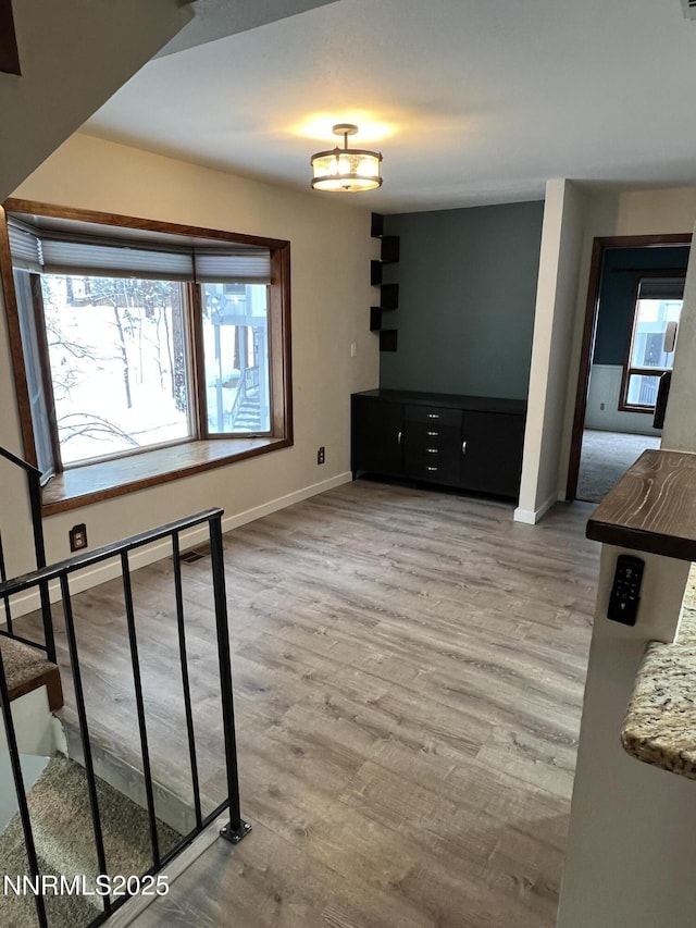 908 Harold Dr Unit 23, Incline Village, NV 89451 - unfurnished living room featuring baseboards and wood finished floors