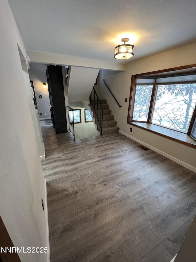 908 Harold Dr Unit 23, Incline Village, NV 89451 - unfurnished living room with stairway and wood finished floors