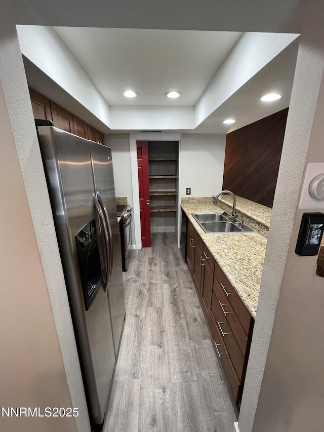 908 Harold Dr Unit 23, Incline Village, NV 89451 - kitchen with stainless steel appliances, light wood-style flooring, recessed lighting, and light stone countertops