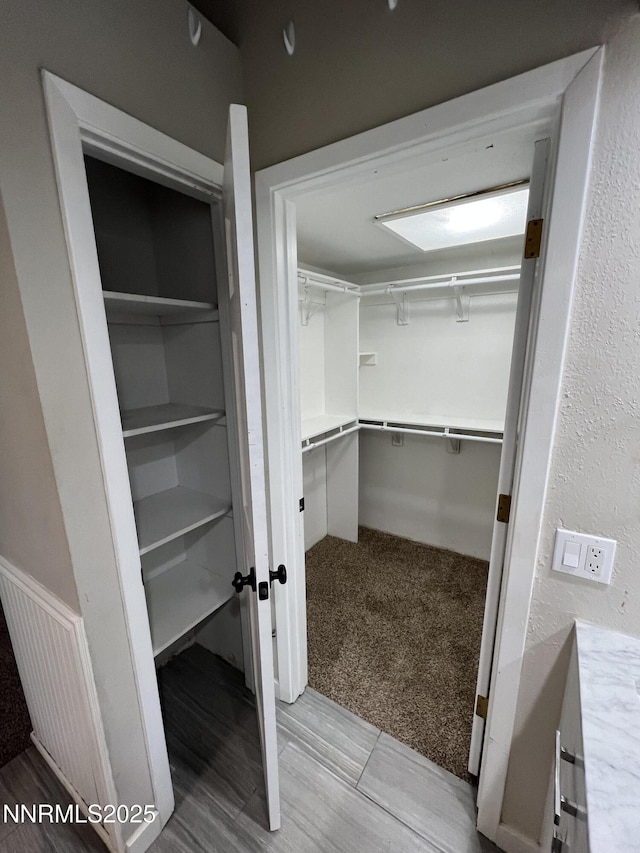 908 Harold Dr Unit 23, Incline Village, NV 89451 - walk in closet with light carpet and light wood finished floors