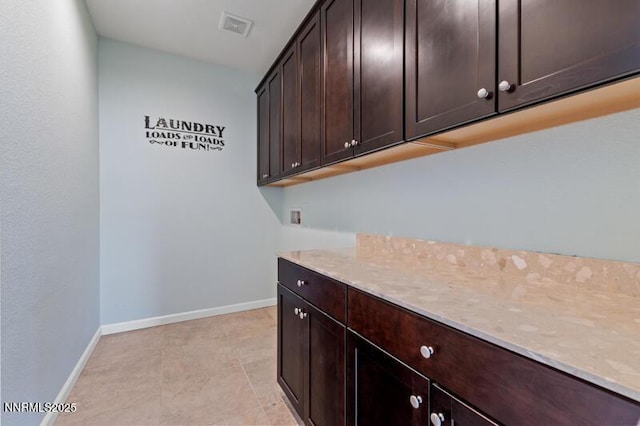 2720 Peavine Pines Ct, Reno, NV 89523 - washroom with cabinet space, washer hookup, and light tile patterned floors