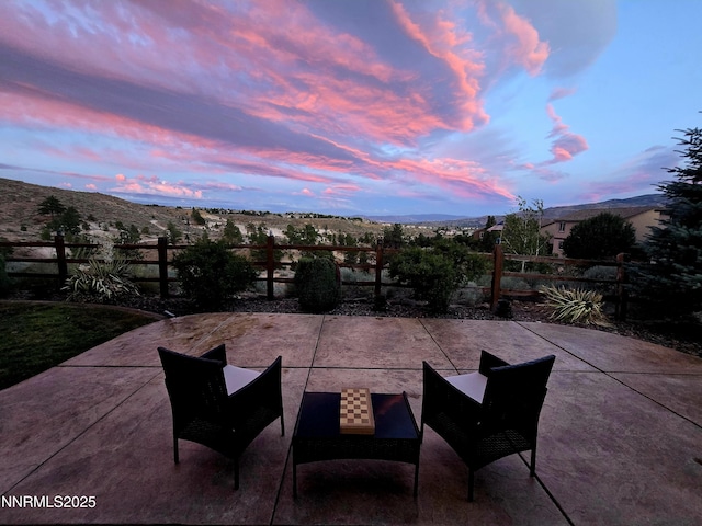 2720 Peavine Pines Ct, Reno, NV 89523 - patio terrace at dusk featuring a patio area and a mountain view