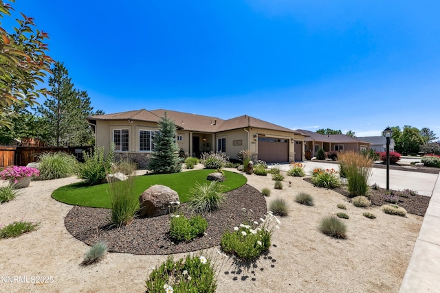 2885 Rio Vis, Minden, NV 89423 - ranch-style home with an attached garage, stucco siding, and driveway