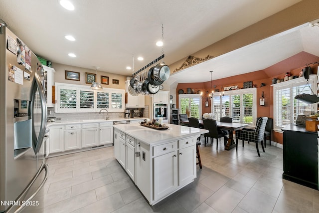 2885 Rio Vis, Minden, NV 89423 - kitchen featuring appliances with stainless steel finishes, light countertops, tasteful backsplash, recessed lighting, and white cabinets