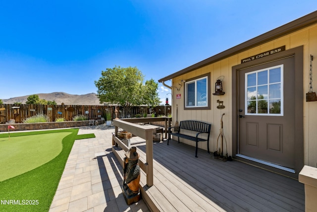 2885 Rio Vis, Minden, NV 89423 - wooden deck featuring a putting area, a fenced backyard, and a mountain view