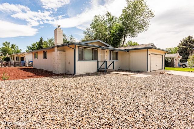 1399 Waterloo Ln, Gardnerville, NV 89410 - single story home with a chimney, an attached garage, and driveway