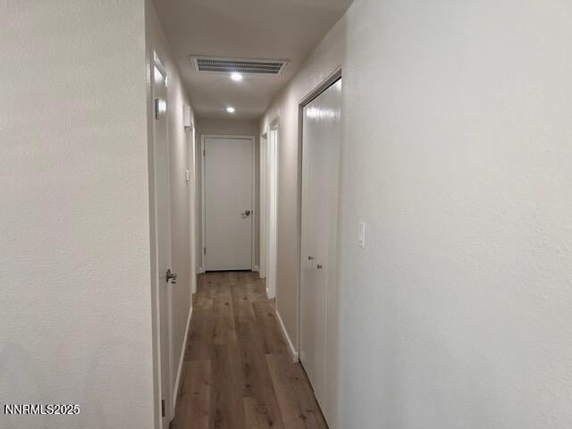 9180 Fremont Way, Reno, NV 89506 - corridor with wood finished floors and baseboards