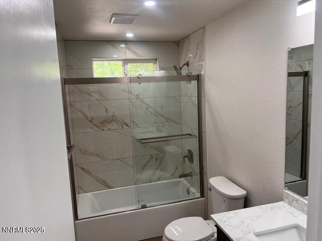 9180 Fremont Way, Reno, NV 89506 - bathroom featuring vanity, enclosed tub / shower combo, and recessed lighting