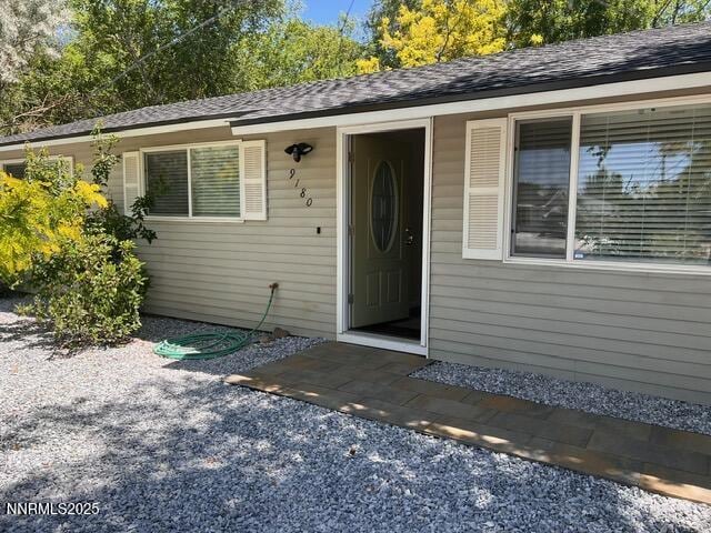 9180 Fremont Way, Reno, NV 89506 - property entrance featuring roof with shingles