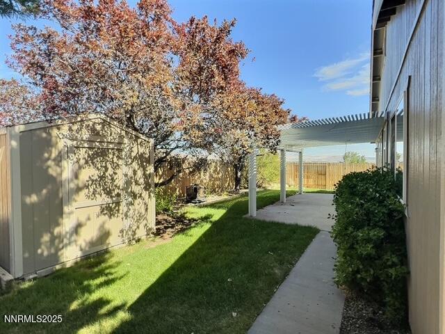 8425 Corrigan Way, Reno, NV 89506 - view of yard with a shed, a patio, and a pergola