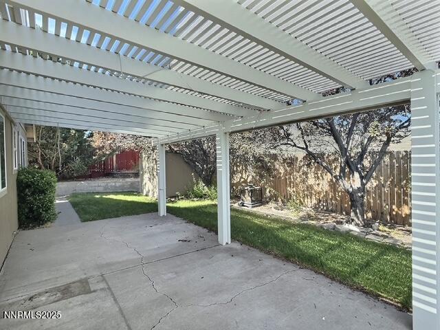 8425 Corrigan Way, Reno, NV 89506 - fenced backyard featuring a patio and a pergola