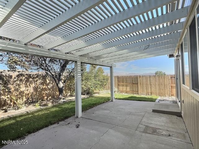 8425 Corrigan Way, Reno, NV 89506 - fenced backyard with a patio area