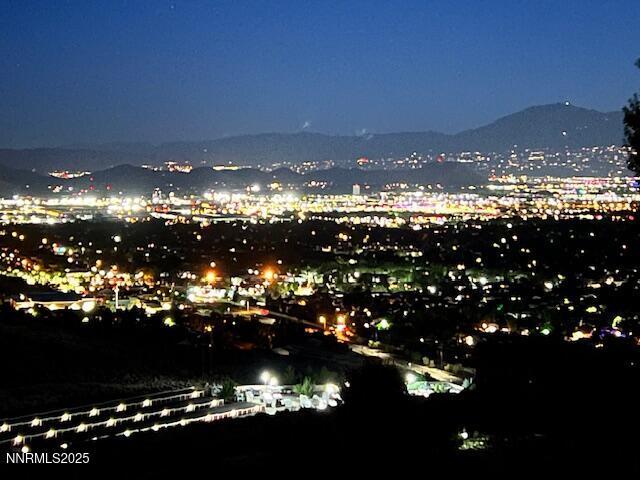 4073 Talladega Dr, Sparks, NV 89436 - view of city with a mountain backdrop and a view of city lights