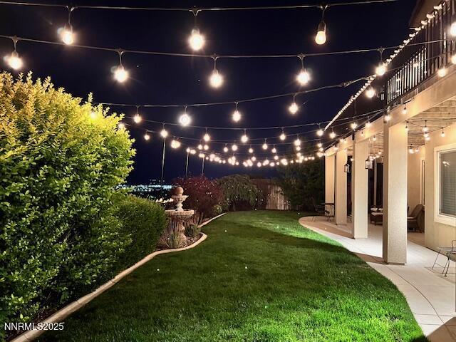4073 Talladega Dr, Sparks, NV 89436 - yard at night with a patio area