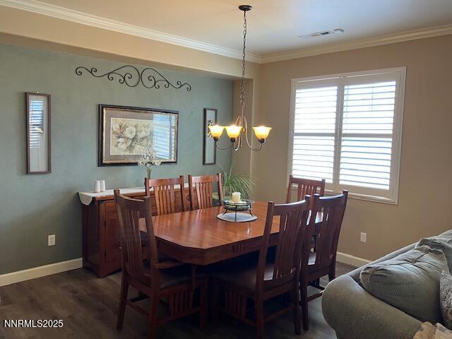 4073 Talladega Dr, Sparks, NV 89436 - dining space featuring a chandelier, wood finished floors, and crown molding