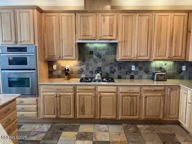 4073 Talladega Dr, Sparks, NV 89436 - kitchen featuring stainless steel appliances, tasteful backsplash, and light stone countertops