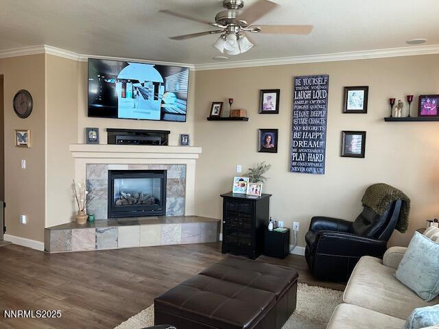 4073 Talladega Dr, Sparks, NV 89436 - living room with ceiling fan, wood finished floors, crown molding, and a tiled fireplace