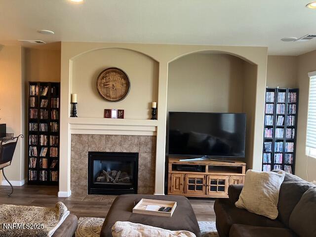4073 Talladega Dr, Sparks, NV 89436 - living area featuring plenty of natural light, wood finished floors, a tile fireplace, and recessed lighting