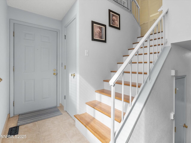 4325 Leeward Ln, Reno, NV 89502 - foyer with stairway and tile patterned floors