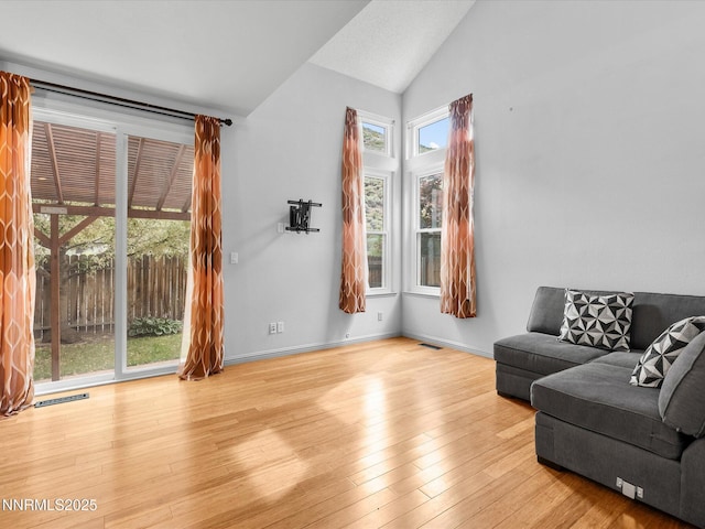 4325 Leeward Ln, Reno, NV 89502 - living room featuring lofted ceiling and wood finished floors