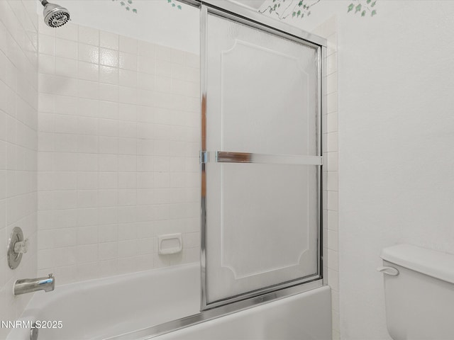 4325 Leeward Ln, Reno, NV 89502 - bathroom featuring toilet and combined bath / shower with glass door
