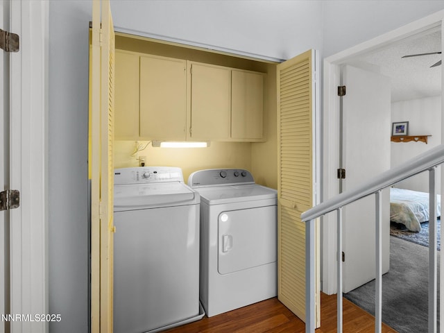 4325 Leeward Ln, Reno, NV 89502 - washroom featuring washing machine and clothes dryer, cabinet space, and dark wood-style flooring