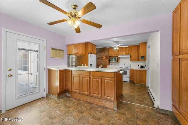 7 Circle Dr, Carson City, NV 89703 - kitchen with white appliances, a baseboard radiator, a peninsula, brown cabinets, and light countertops