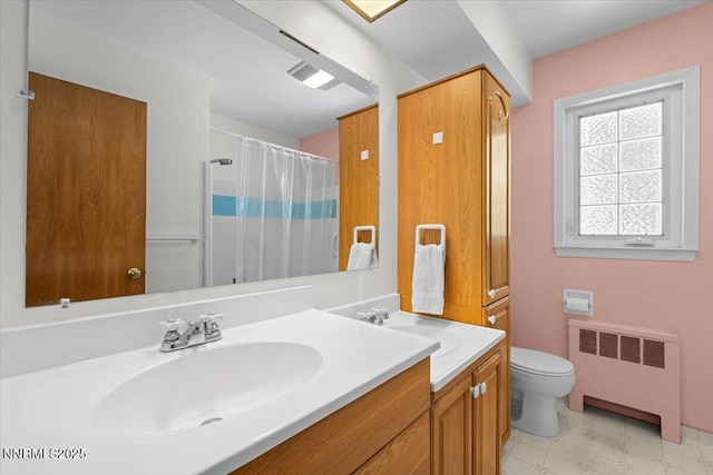 7 Circle Dr, Carson City, NV 89703 - bathroom featuring radiator heating unit and vanity