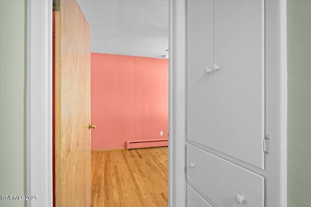 7 Circle Dr, Carson City, NV 89703 - hallway featuring baseboard heating and light wood-style floors