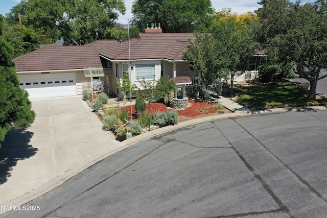 7 Circle Dr, Carson City, NV 89703 - view of front of house featuring a tile roof, driveway, a garage, and a front lawn