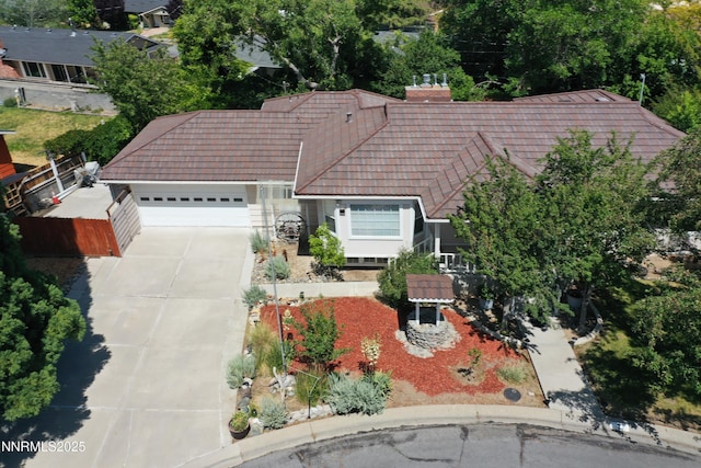 7 Circle Dr, Carson City, NV 89703 - view of front of house featuring a garage, a tile roof, and driveway