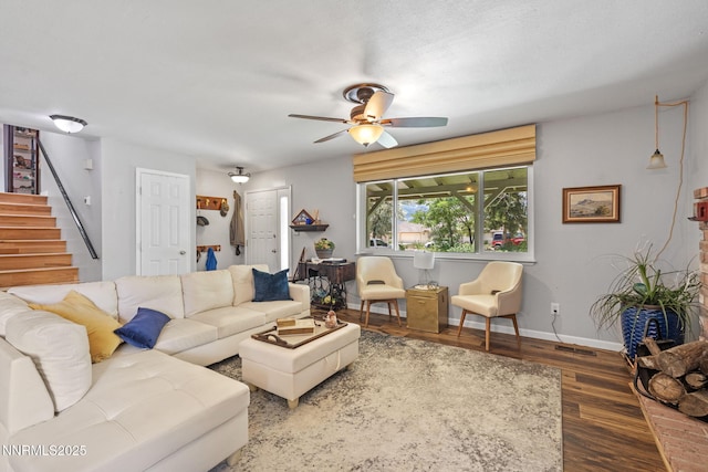2450 Chukar Dr, Washoe Valley, NV 89704 - living area with wood finished floors, a ceiling fan, and stairs