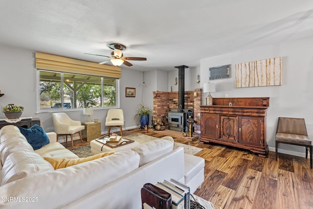 2450 Chukar Dr, Washoe Valley, NV 89704 - living room featuring ceiling fan, wood finished floors, and a wood stove
