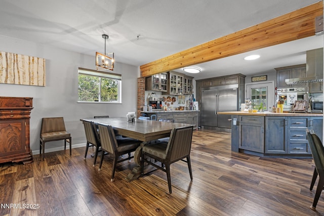 2450 Chukar Dr, Washoe Valley, NV 89704 - dining area with dark wood-style flooring, a chandelier, recessed lighting, and beamed ceiling