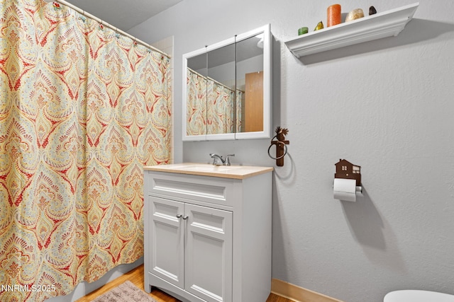 2450 Chukar Dr, Washoe Valley, NV 89704 - bathroom with vanity, wood finished floors, and curtained shower