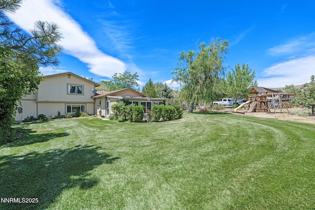 2450 Chukar Dr, Washoe Valley, NV 89704 - view of grassy yard featuring a playground