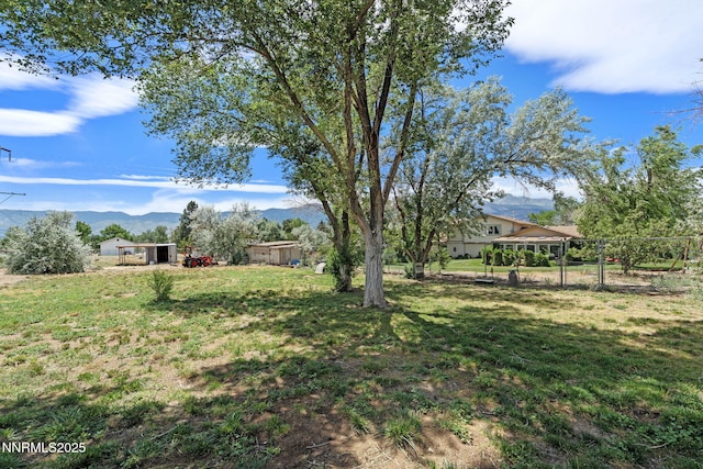 2450 Chukar Dr, Washoe Valley, NV 89704 - view of green lawn featuring a gazebo and a mountain view
