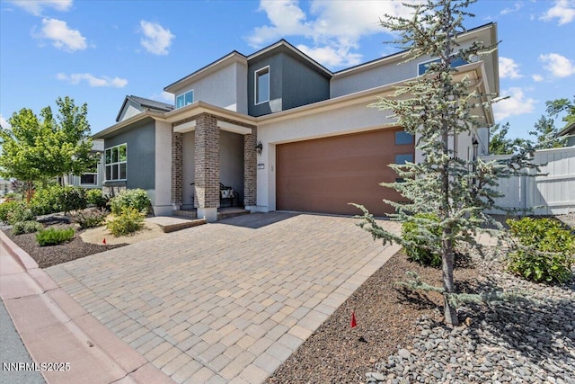 5517 Western Rider Trl, Reno, NV 89511 - contemporary home with stucco siding, decorative driveway, and an attached garage