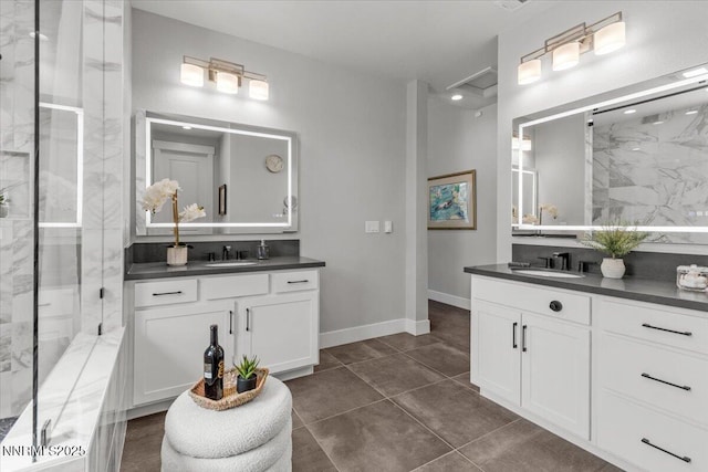 5517 Western Rider Trl, Reno, NV 89511 - bathroom with two vanities, a marble finish shower, and tile patterned floors