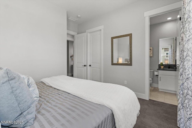 5517 Western Rider Trl, Reno, NV 89511 - bedroom with dark carpet and ensuite bath