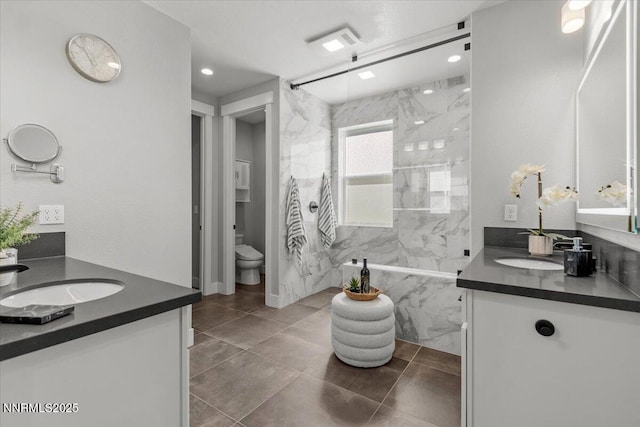 5517 Western Rider Trl, Reno, NV 89511 - full bath featuring two vanities, a marble finish shower, and recessed lighting