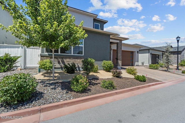 5517 Western Rider Trl, Reno, NV 89511 - view of front of property featuring driveway, an attached garage, and stucco siding