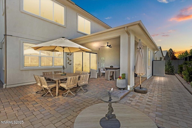 5517 Western Rider Trl, Reno, NV 89511 - patio terrace at dusk with a patio area and outdoor dining space