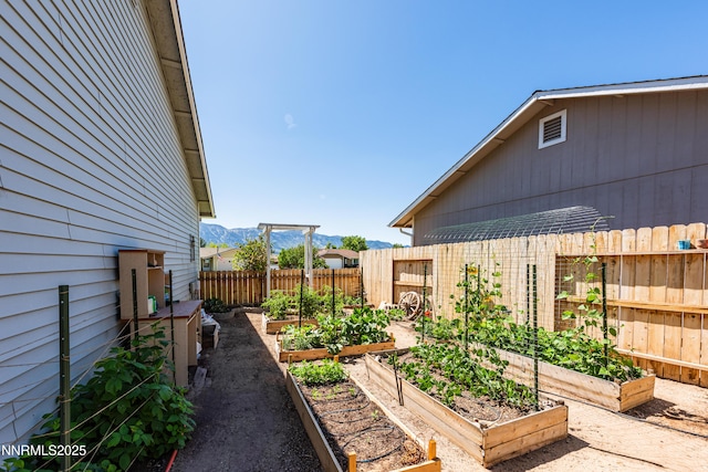 653 Carmel Way, Gardnerville, NV 89460 - view of yard with a vegetable garden and a mountain view
