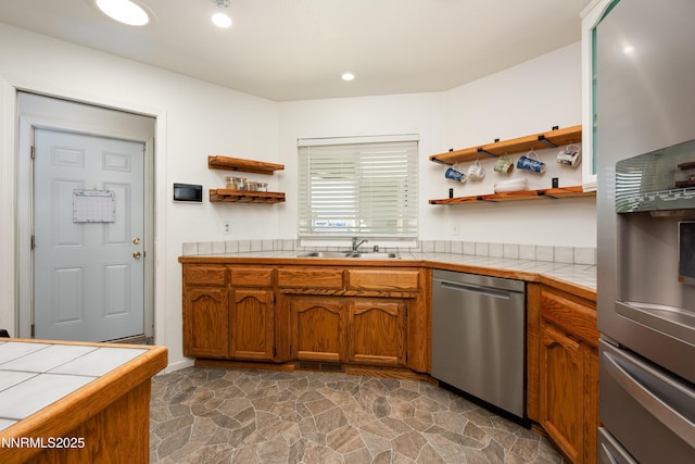 653 Carmel Way, Gardnerville, NV 89460 - kitchen featuring appliances with stainless steel finishes, tile countertops, open shelves, dark stone finish floors, and recessed lighting