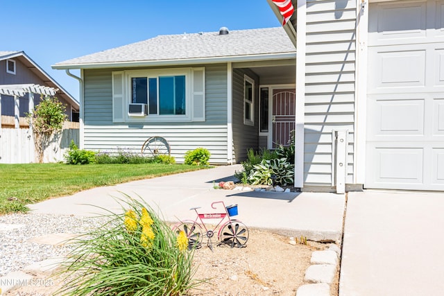 653 Carmel Way, Gardnerville, NV 89460 - view of exterior entry featuring a shingled roof and cooling unit