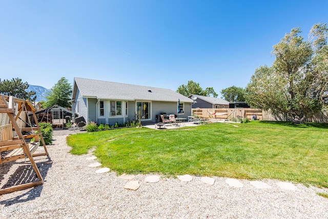 653 Carmel Way, Gardnerville, NV 89460 - rear view of house with a patio area, a fenced backyard, and a mountain view