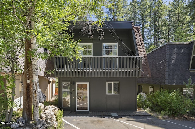 978 Glenrock Dr Unit 36, Incline Village, NV 89451 - rear view of house featuring a balcony, uncovered parking, and roof with shingles
